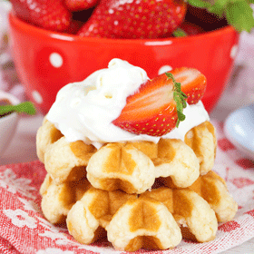 Waffles from Liège with whipped cream and fresh strawberries