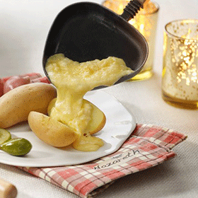 Raclette with cheese ’Nazareth’ and cooked potatoes in the skin