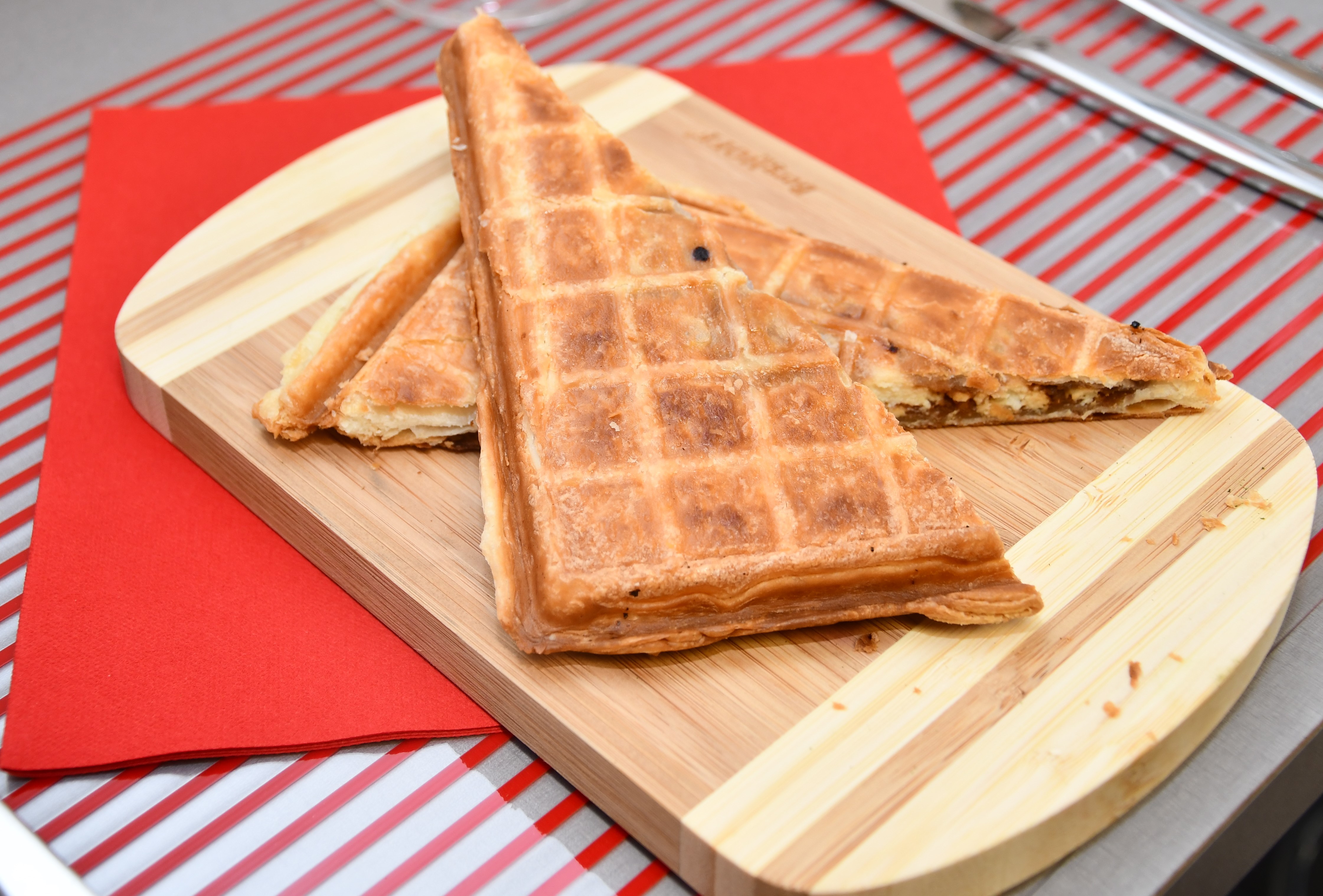 Savory waffle filled with goat cheese, bacon and honey